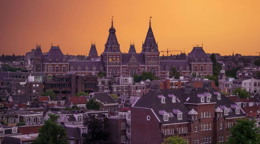 a view of the Amsterdam skyline at sunset