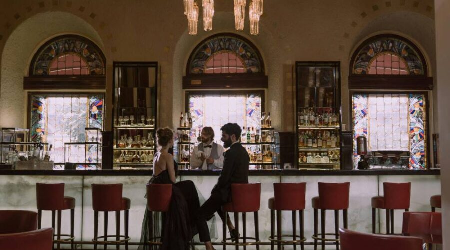 A professional couple sat the bar